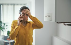 woman calling plumber to fix broken water heater Venice, FL